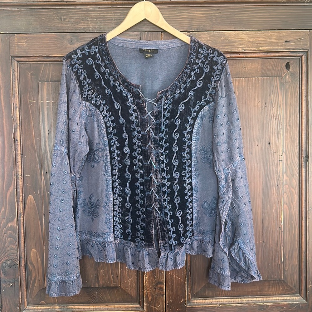 Tunic one size but it fits me and I wear med and large